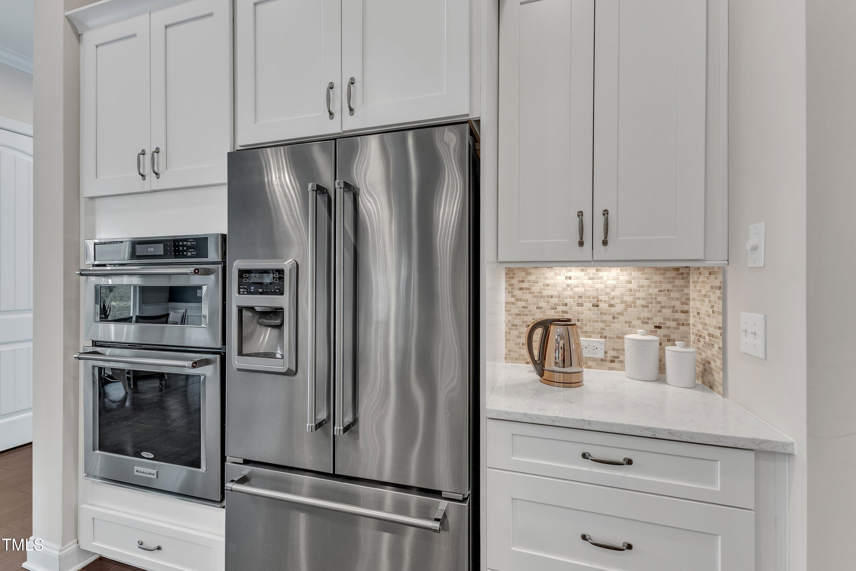 8121 Greys Landing Way Raleigh, NC 27615 - Photo 20 of 95 a kitchen with appliances and cabinets