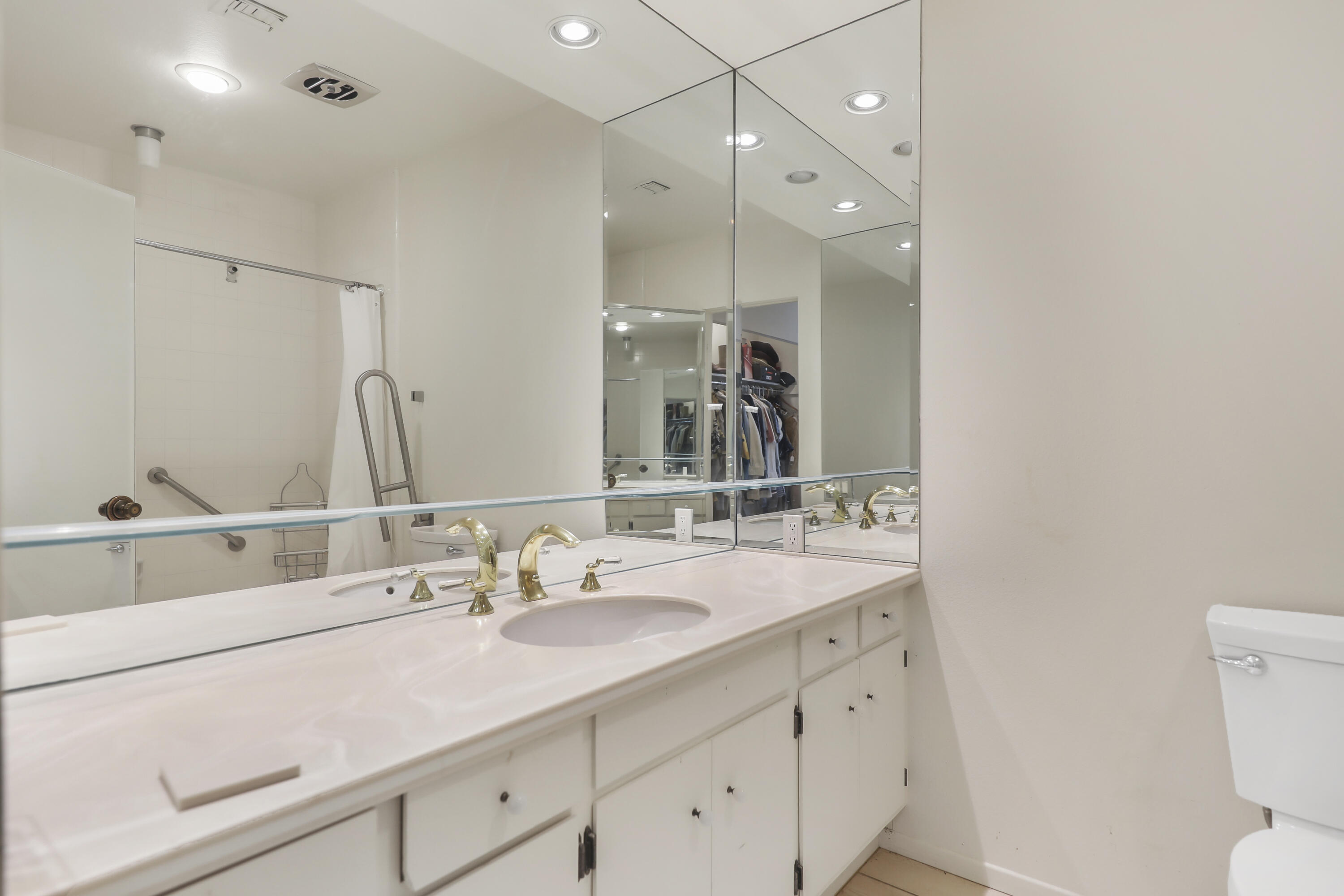 770 South La Mirada Road Palm Springs, CA 92264 - Photo 9 of 39 a bathroom with a sink double vanity granite and a toilet