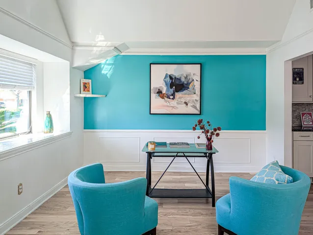 a living room with furniture and a window