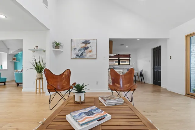 a living room with furniture and a rug