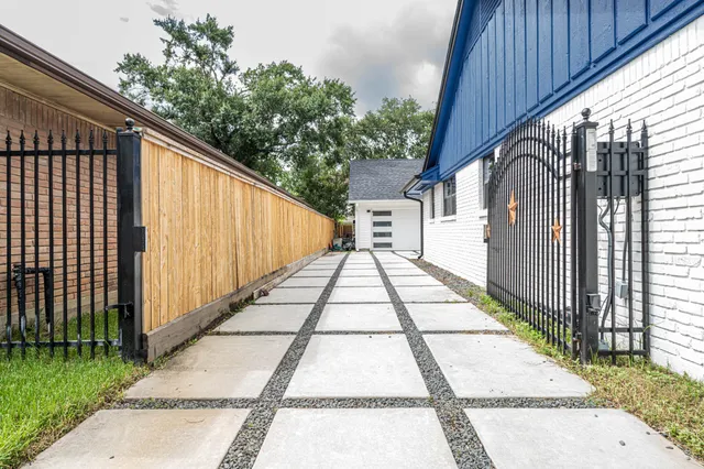 a view of a house with backyard and wooden floor