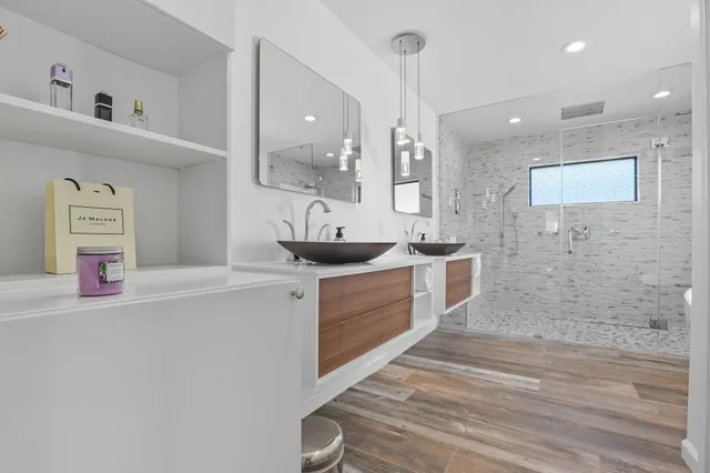 a large bathroom with a sink a vanity and mirror