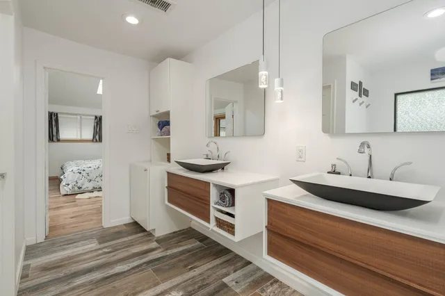 a kitchen with stainless steel appliances kitchen island granite countertop a sink and cabinets