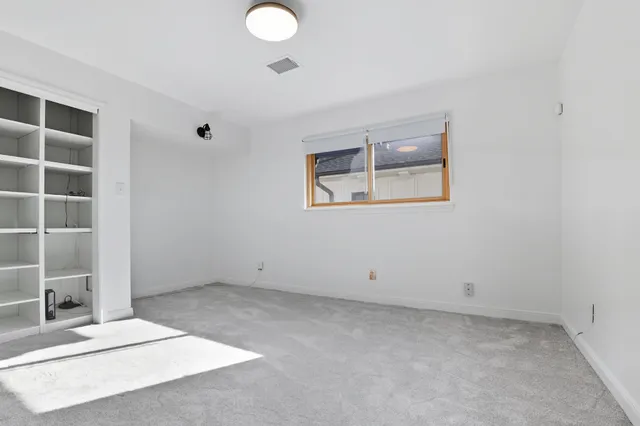 a view of room with window and closet