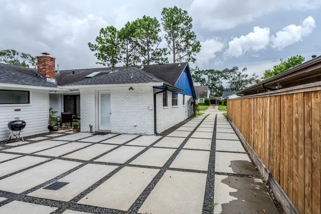 a house view with a backyard space