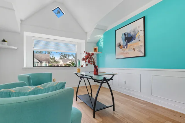 a view of a livingroom with furniture and a workspace