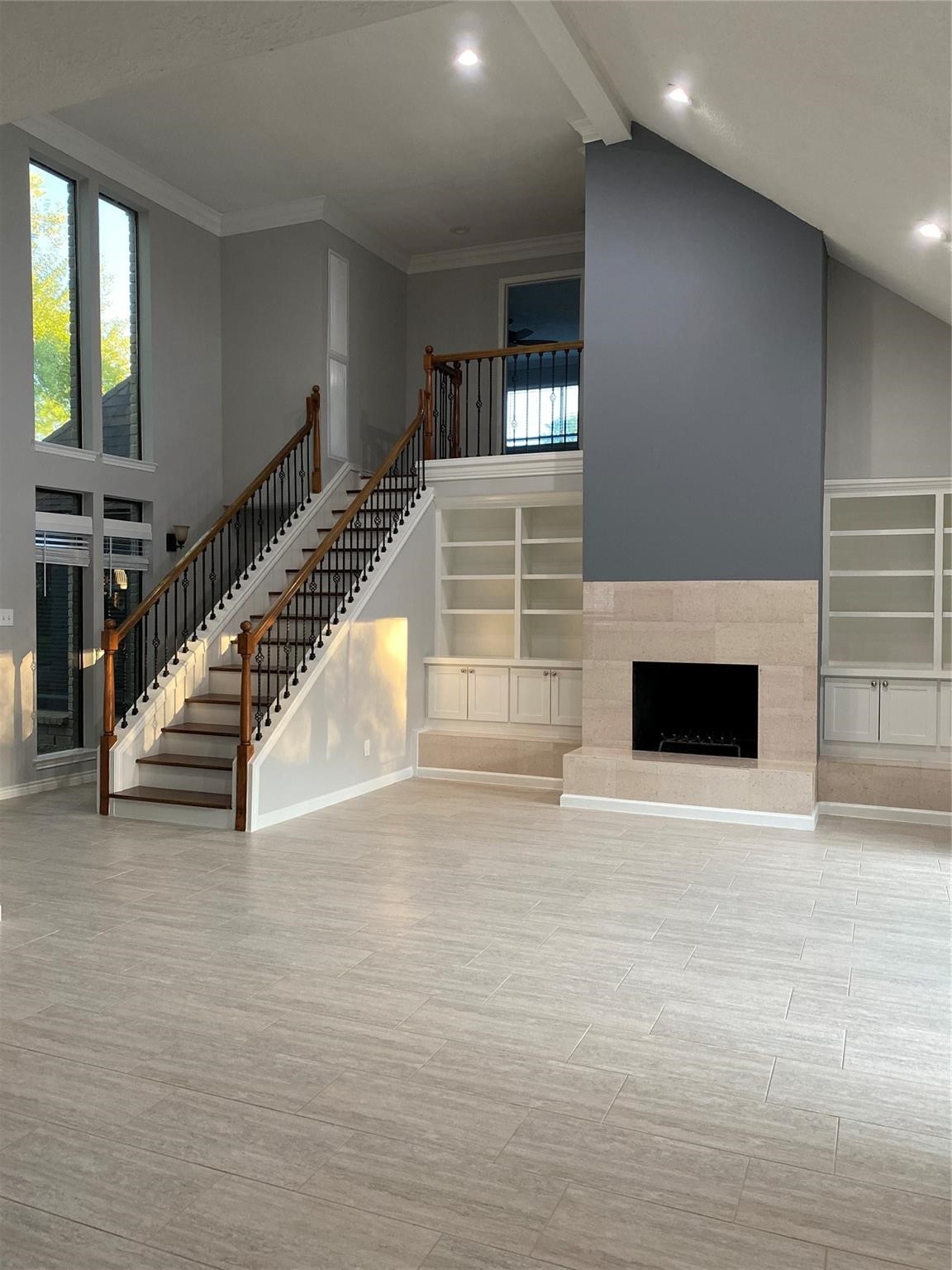 1622 Fall Valley Drive Houston, TX 77077 - Photo 2 of 10 a view of an empty room with wooden floor and a fireplace