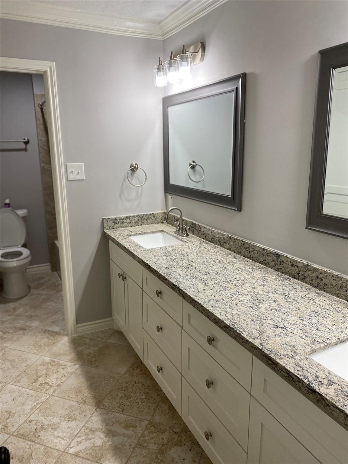 1622 Fall Valley Drive Houston, TX 77077 - Photo 5 of 10 a bathroom with a granite countertop sink and a mirror
