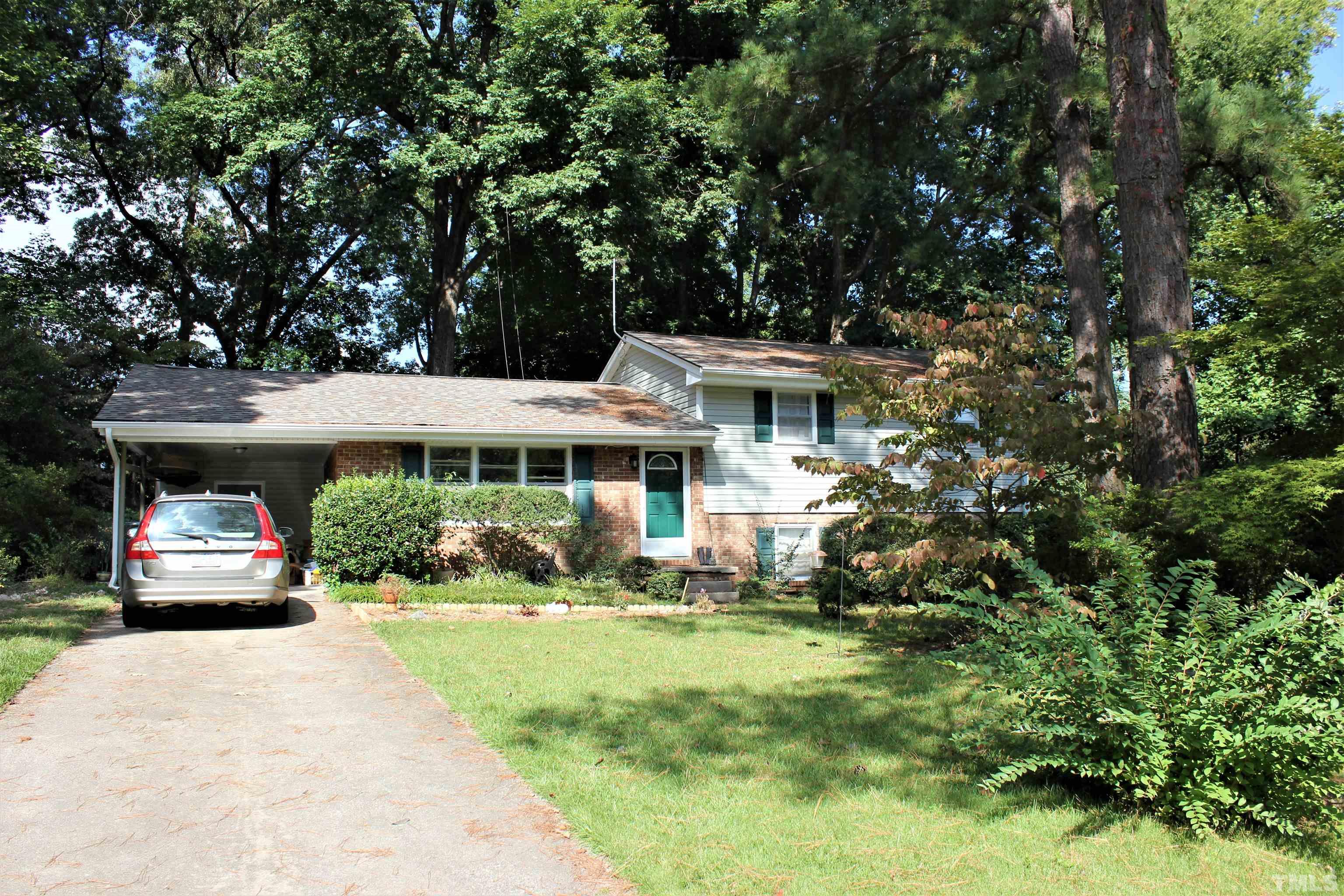 3205 Fairforest Place Raleigh, NC 27604 - Photo 2 of 28 a front view of a house with a yard
