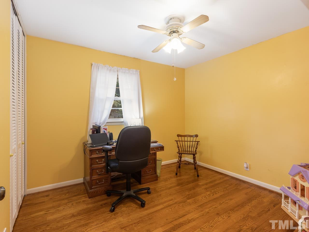 3205 Fairforest Place Raleigh, NC 27604 - Photo 15 of 28 a view of a workspace with furniture and a window