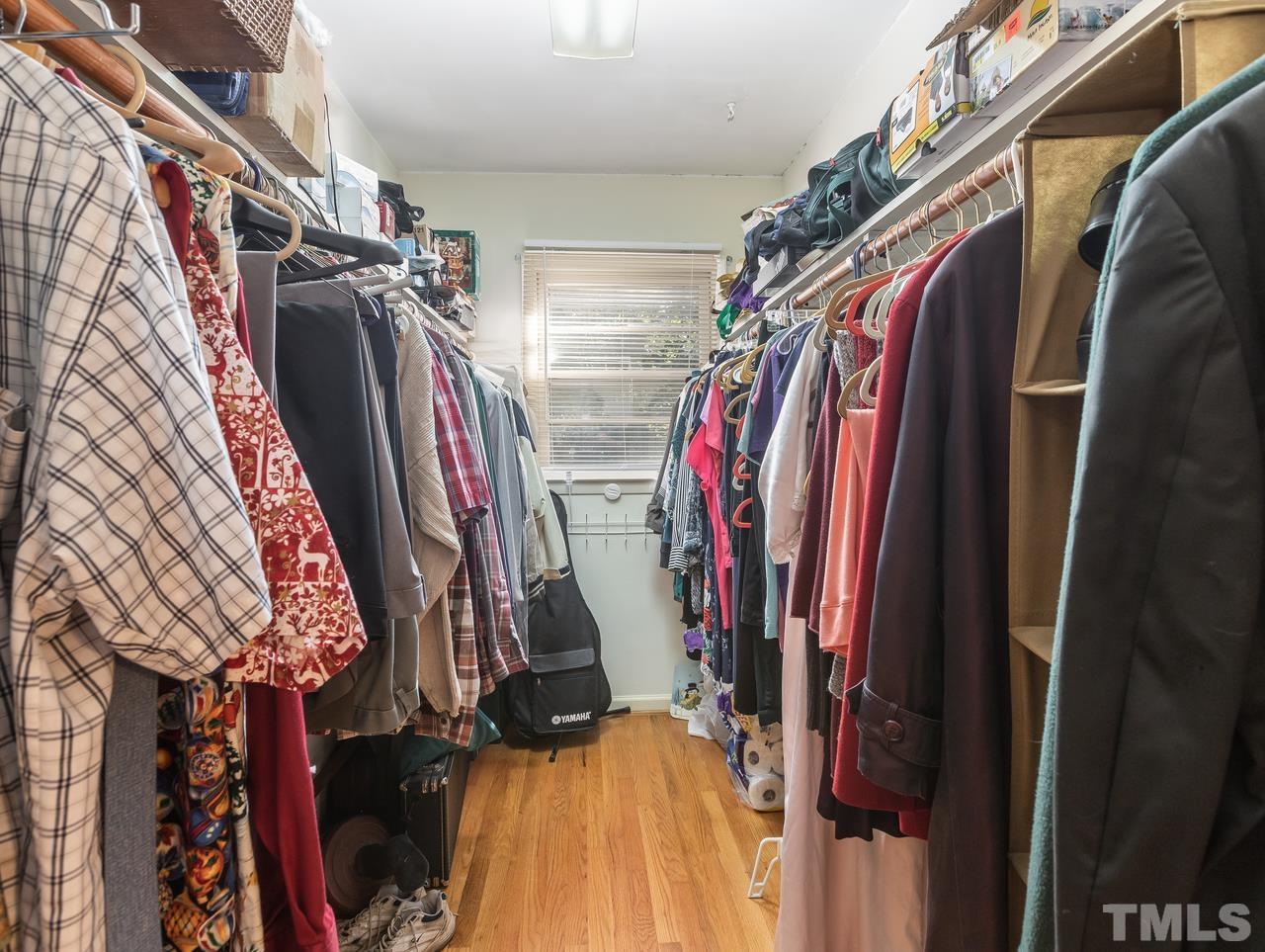 3205 Fairforest Place Raleigh, NC 27604 - Photo 21 of 28 a view of walk in closet with clothes and shoes