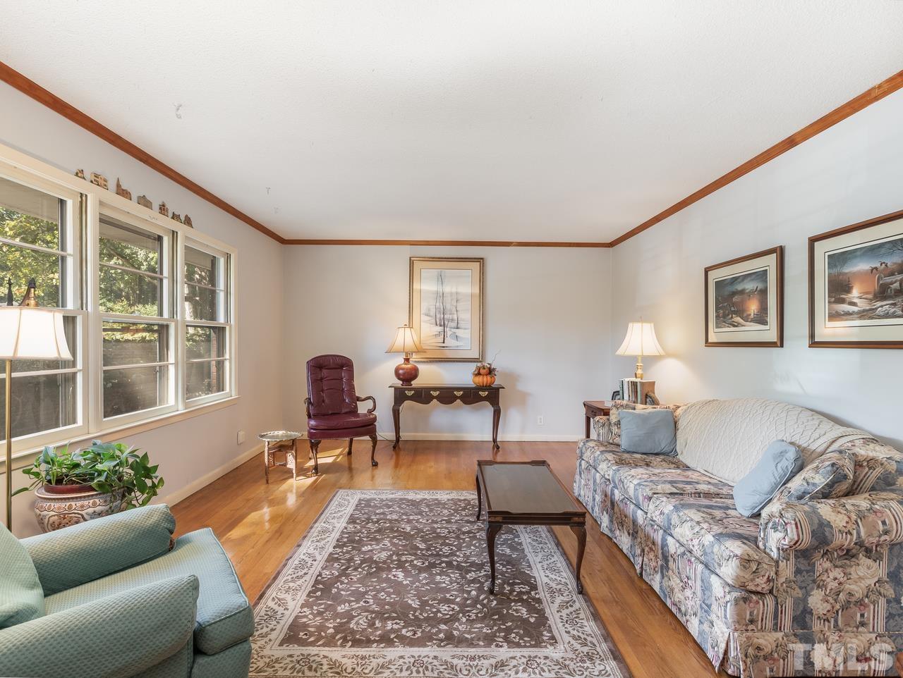 3205 Fairforest Place Raleigh, NC 27604 - Photo 22 of 28 a living room with furniture and a potted plant