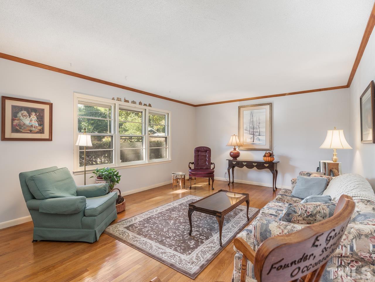 3205 Fairforest Place Raleigh, NC 27604 - Photo 24 of 28 a living room with furniture and a window