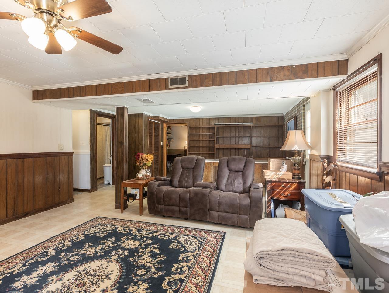 3205 Fairforest Place Raleigh, NC 27604 - Photo 27 of 28 a living room with furniture and a rug