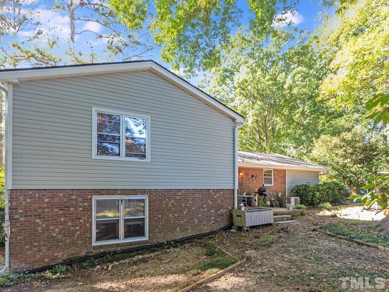 3205 Fairforest Place Raleigh, NC 27604 - Photo 7 of 28 a view of a house with a yard and sitting area