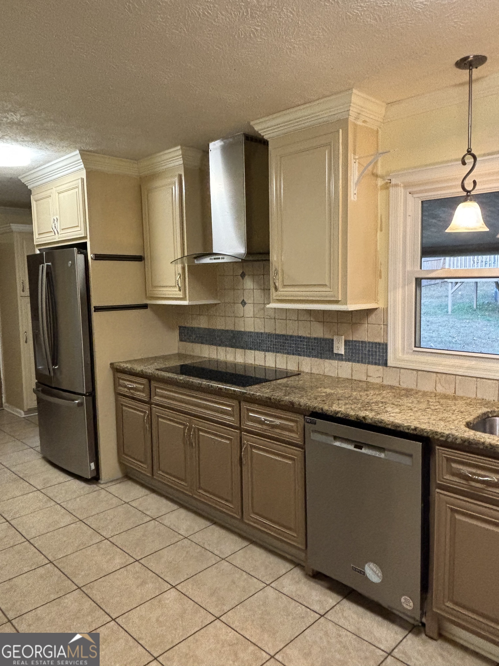 228 Sivell Road LaGrange, GA 30241 - Photo 12 of 64 a kitchen with stainless steel appliances granite countertop a sink and a refrigerator