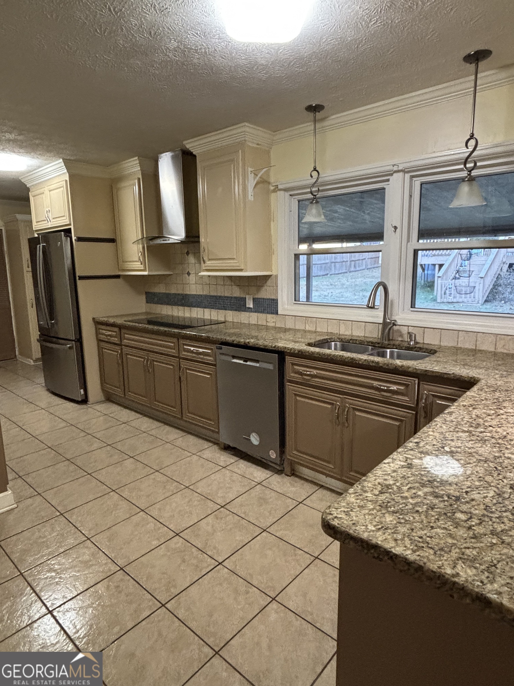 228 Sivell Road LaGrange, GA 30241 - Photo 13 of 64 a kitchen with stainless steel appliances granite countertop a sink and a stove