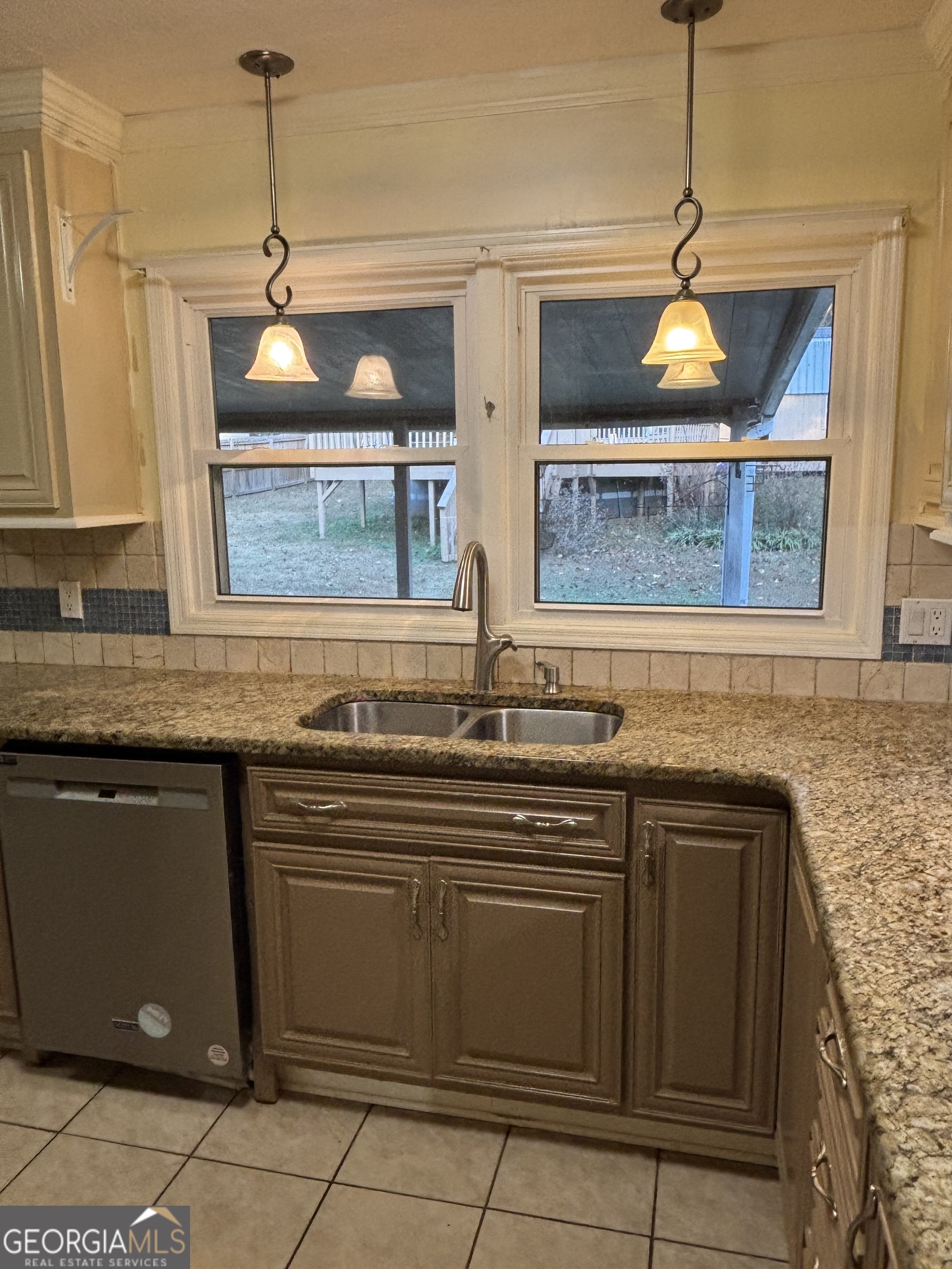 228 Sivell Road LaGrange, GA 30241 - Photo 15 of 64 a kitchen with a sink and chandelier