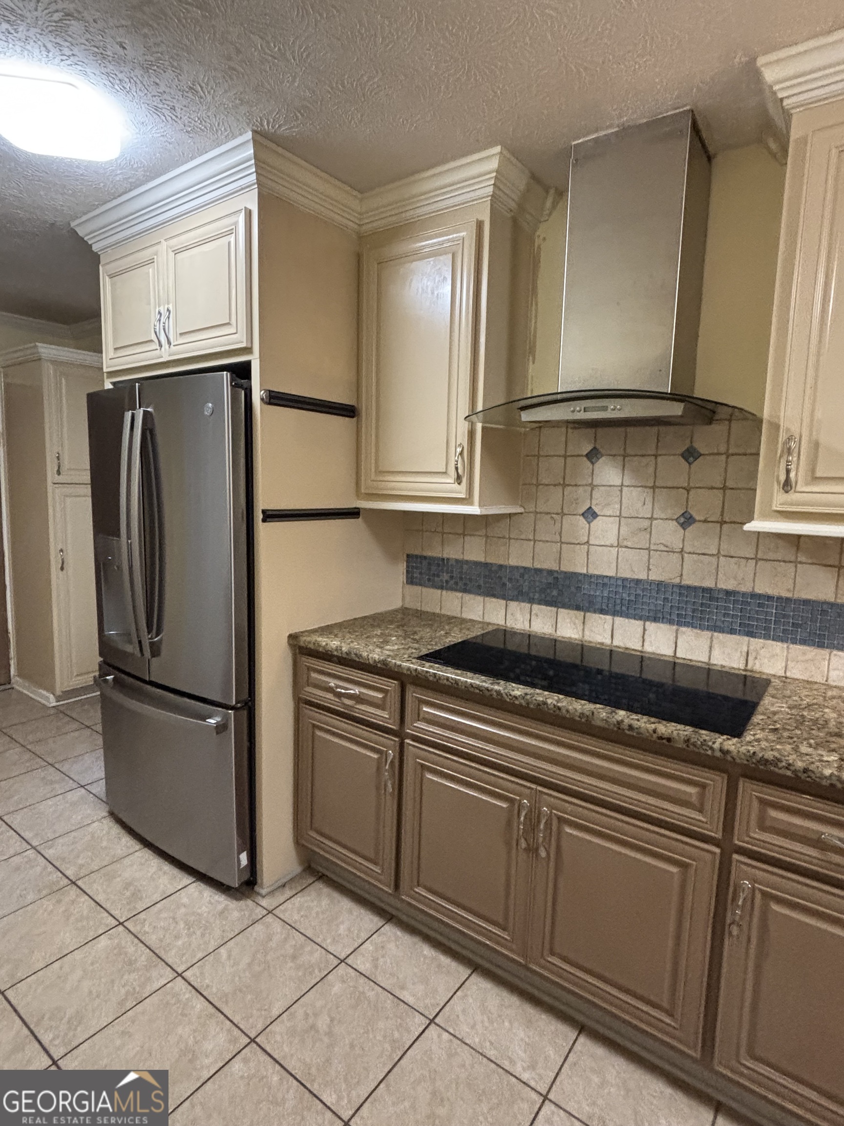 228 Sivell Road LaGrange, GA 30241 - Photo 17 of 64 a kitchen with stainless steel appliances granite countertop a refrigerator sink and stove