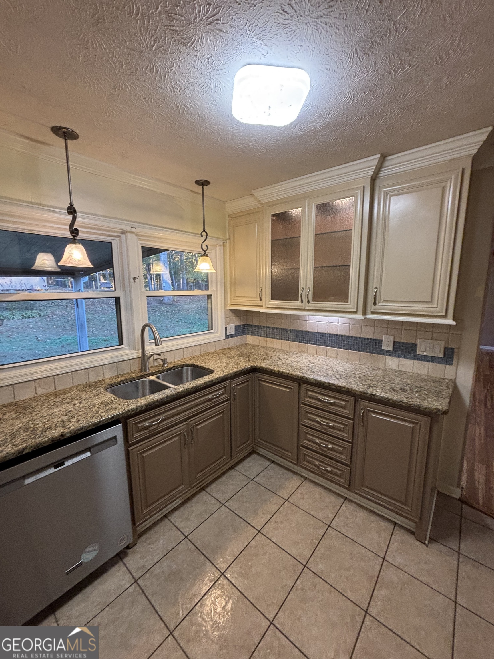 228 Sivell Road LaGrange, GA 30241 - Photo 18 of 64 a kitchen with stainless steel appliances granite countertop a sink and cabinets