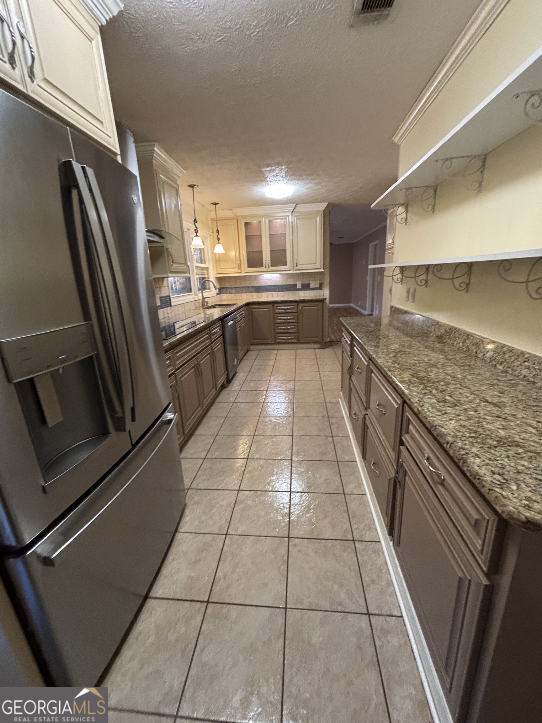 228 Sivell Road LaGrange, GA 30241 - Photo 20 of 64 a kitchen with stainless steel appliances granite countertop a refrigerator and a stove