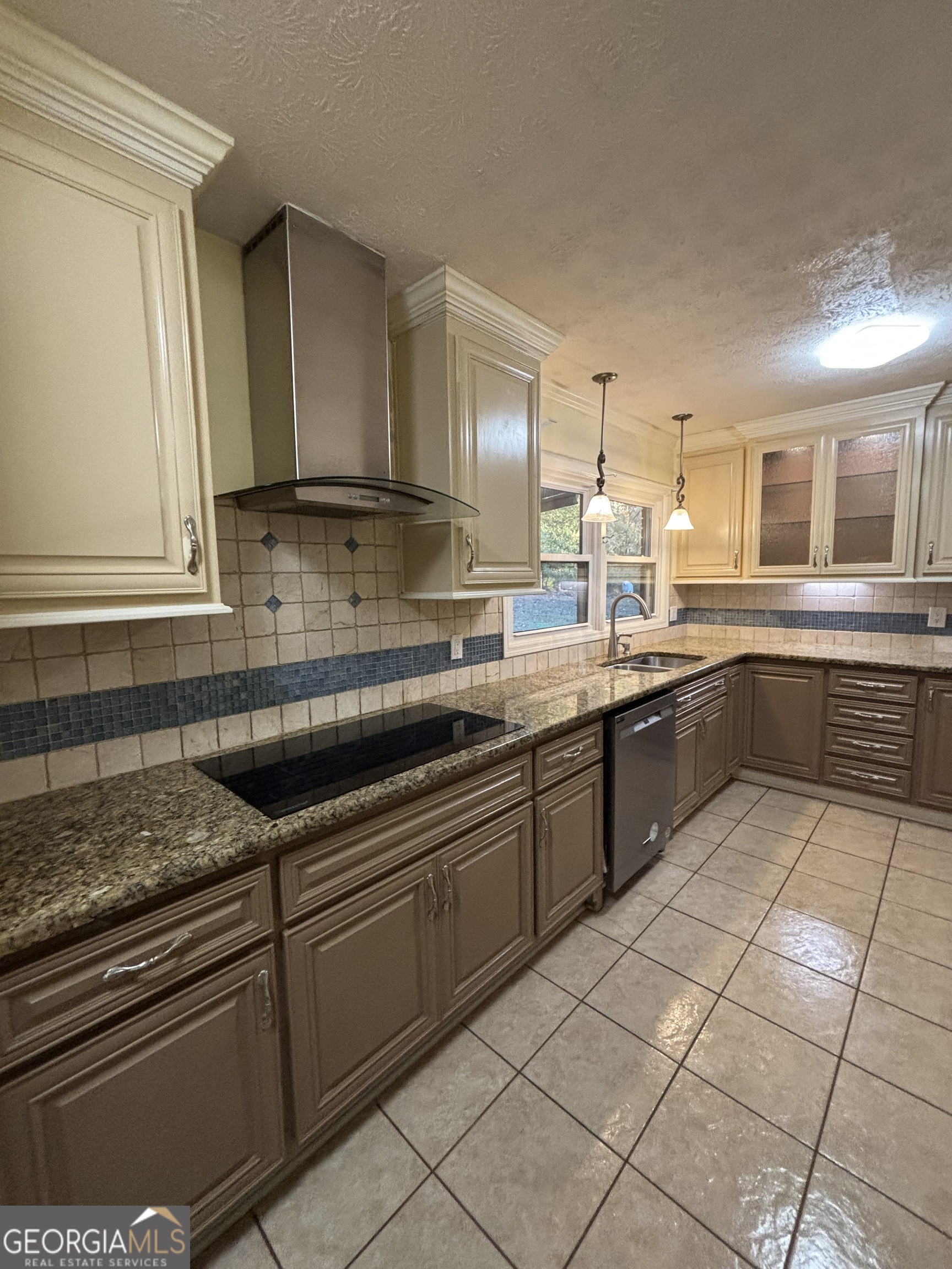 228 Sivell Road LaGrange, GA 30241 - Photo 21 of 64 a kitchen with a sink cabinets and window