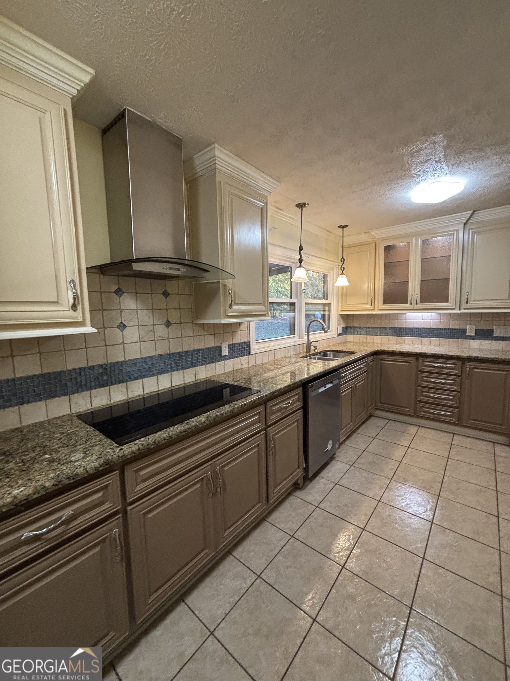 228 Sivell Road LaGrange, GA 30241 - Photo 22 of 64 a kitchen with a sink and cabinets