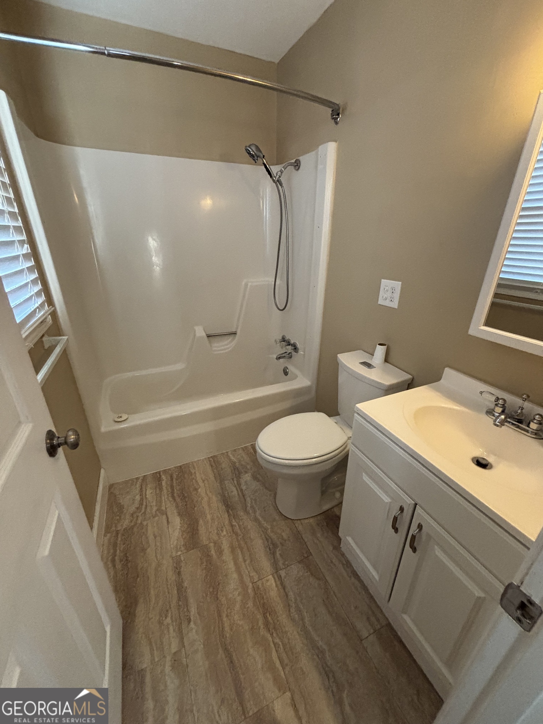 228 Sivell Road LaGrange, GA 30241 - Photo 28 of 64 a bathroom with a granite countertop sink toilet and shower