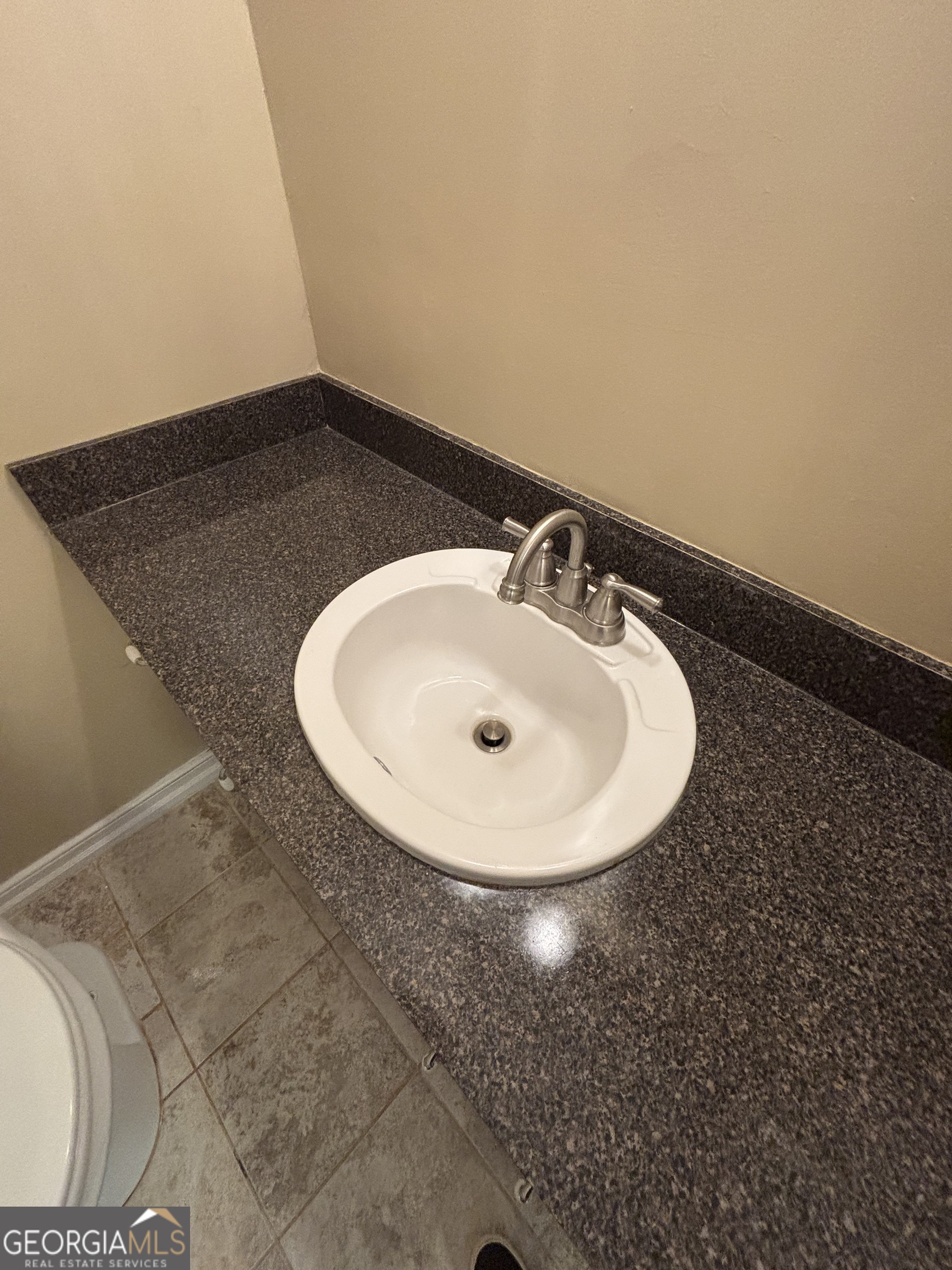 228 Sivell Road LaGrange, GA 30241 - Photo 30 of 64 a bathroom with a sink and a mirror