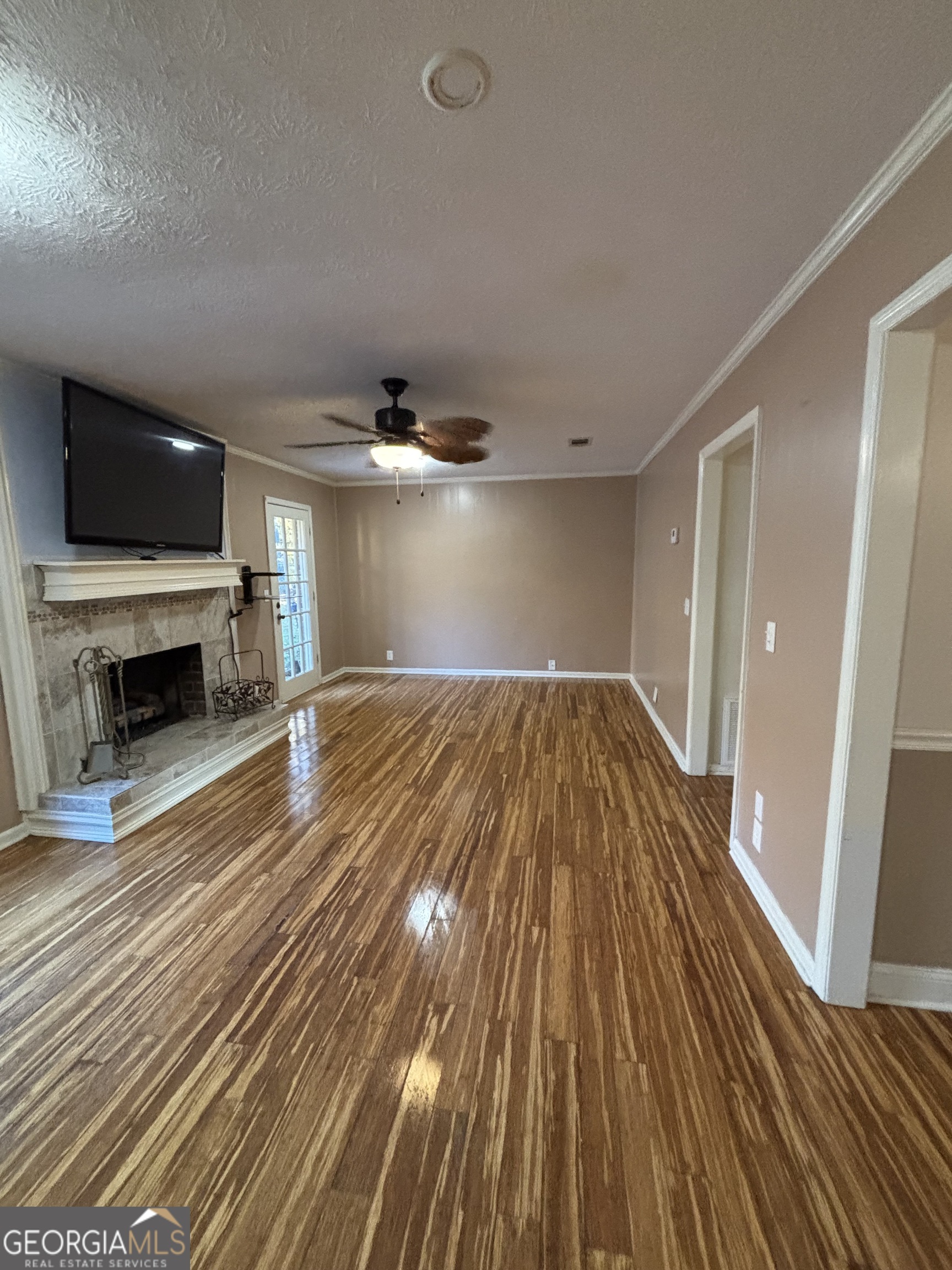 228 Sivell Road LaGrange, GA 30241 - Photo 40 of 64 a view of empty room with wooden floor and fireplace