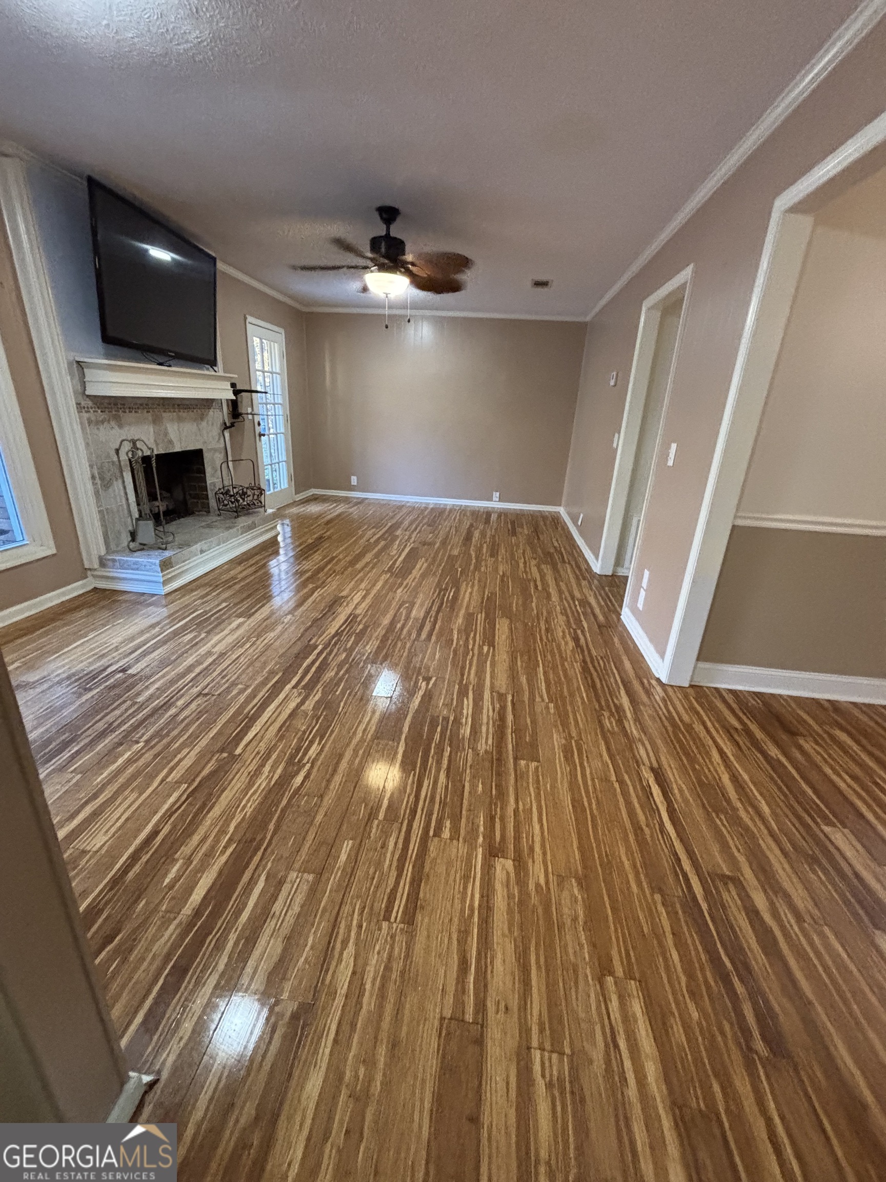 228 Sivell Road LaGrange, GA 30241 - Photo 41 of 64 a view of empty room with wooden floor and fireplace