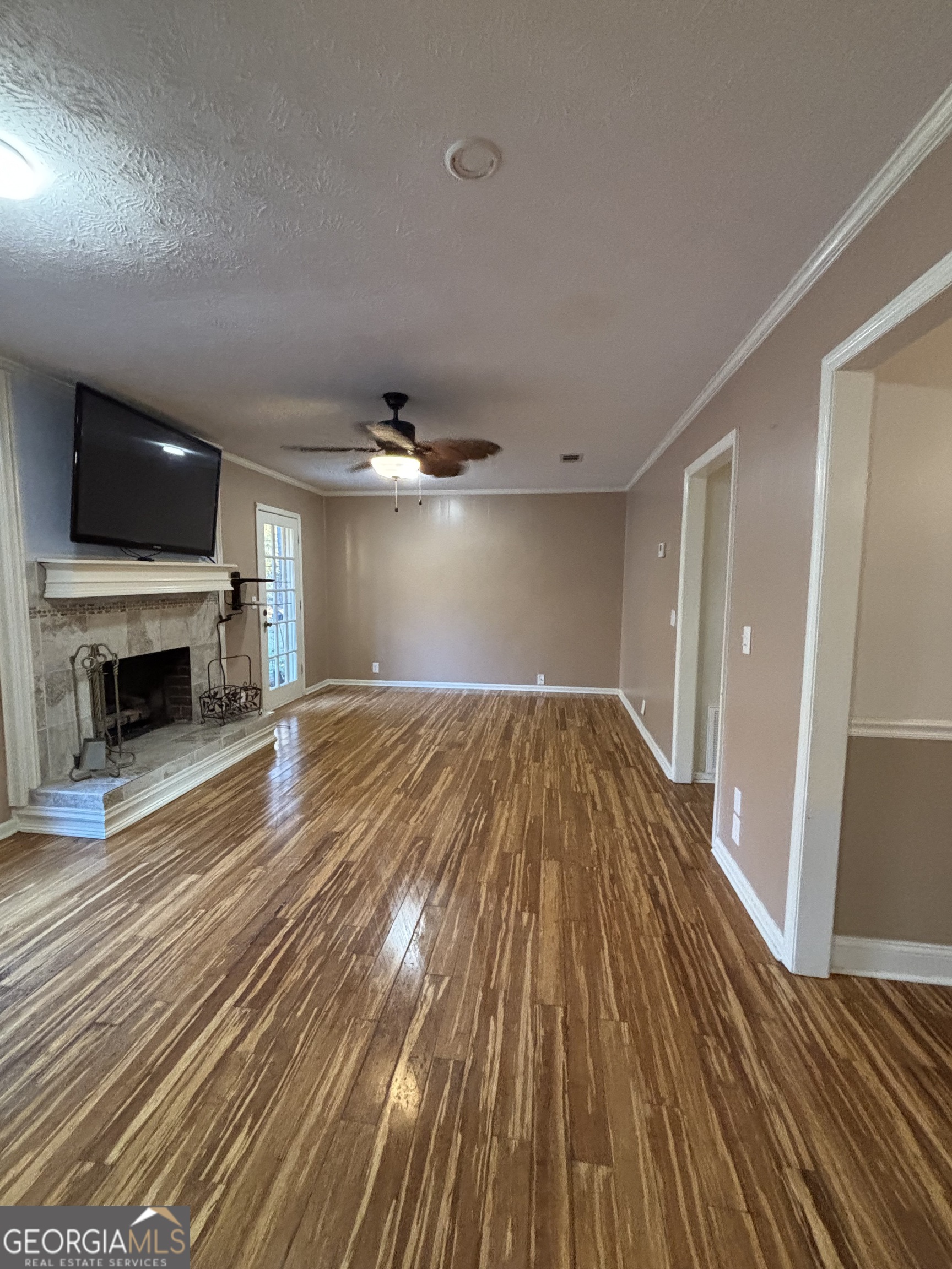 228 Sivell Road LaGrange, GA 30241 - Photo 44 of 64 a view of empty room with wooden floor and fireplace