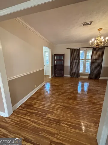 a view of a deck with a table and chair