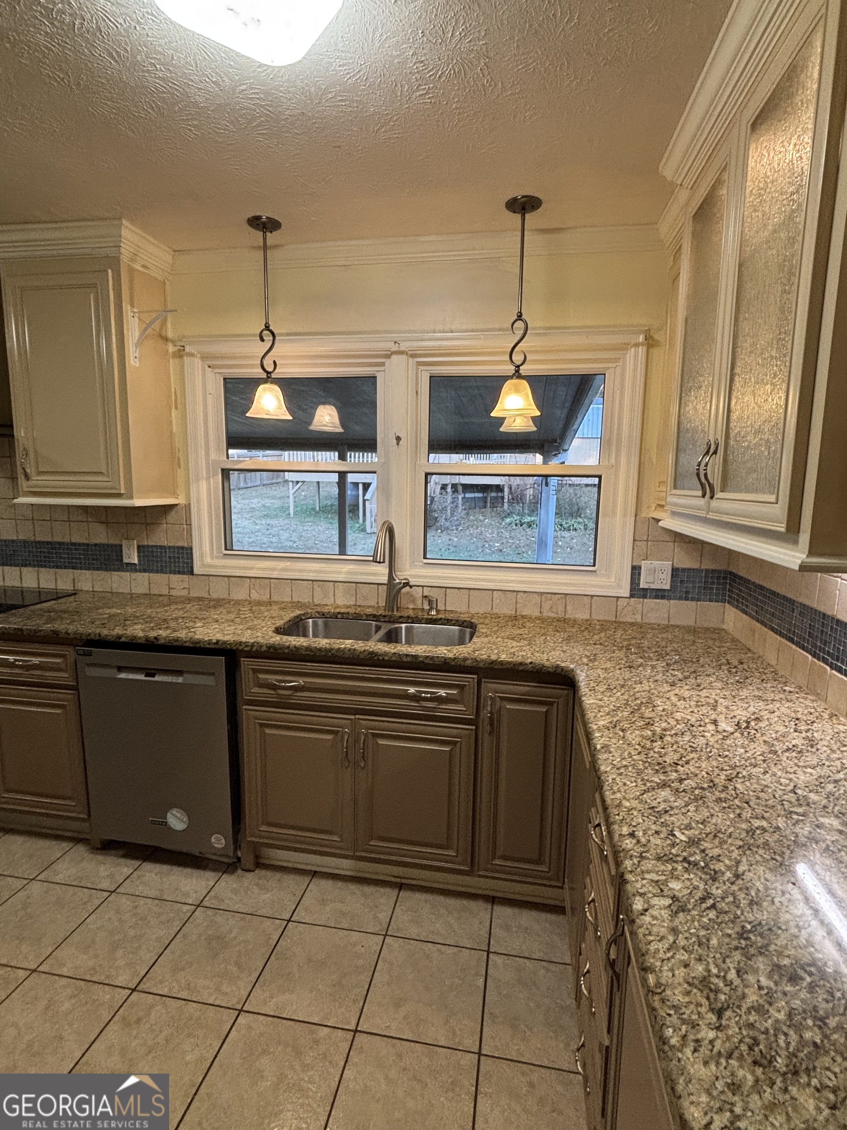 228 Sivell Road LaGrange, GA 30241 - Photo 48 of 64 a kitchen with stainless steel appliances granite countertop a stove a sink and a microwave