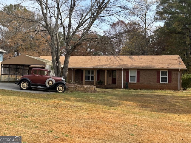 228 Sivell Road LaGrange, GA 30241 - Photo 50 of 64 a view of a car parked in front of a house