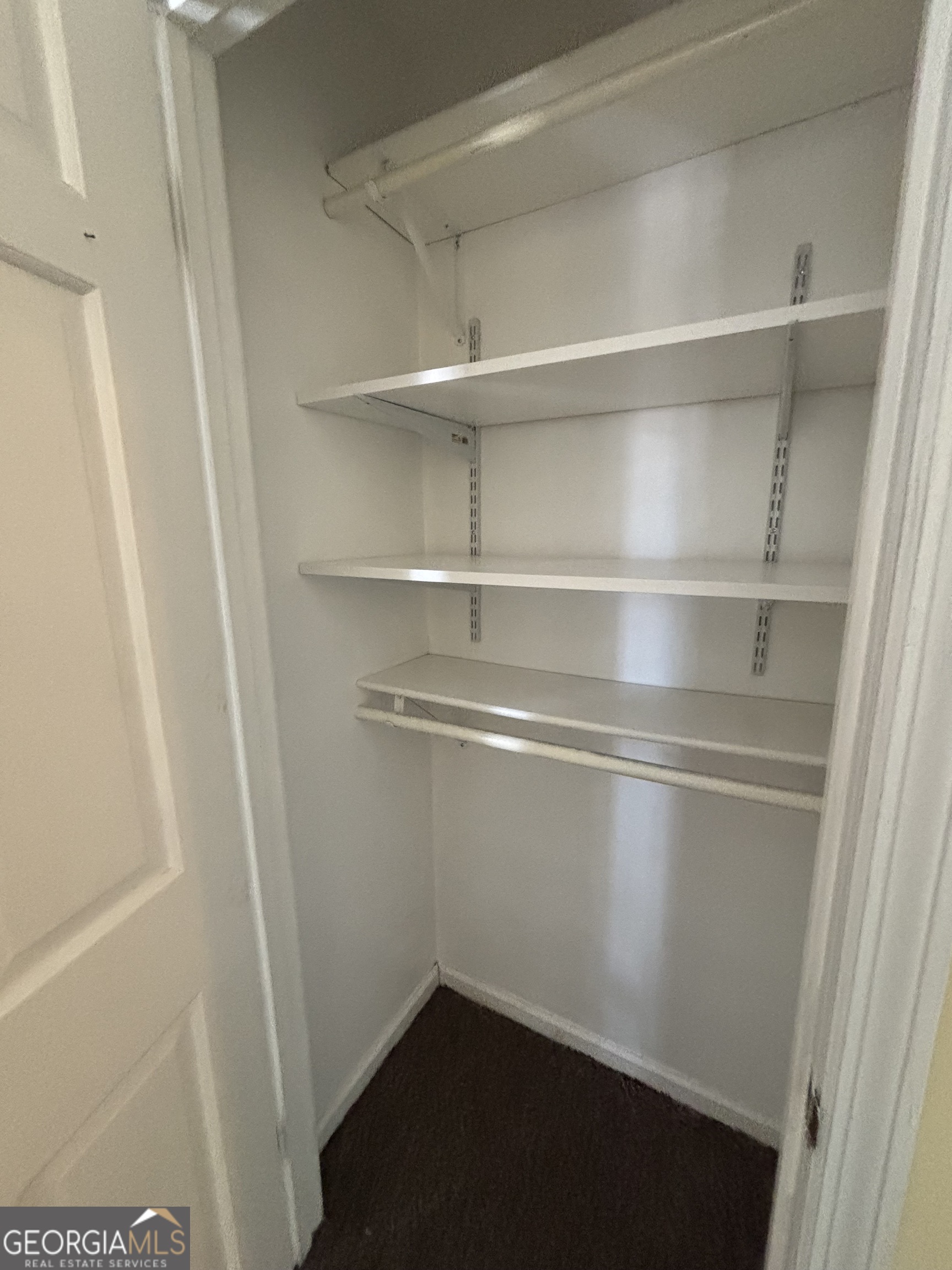 228 Sivell Road LaGrange, GA 30241 - Photo 5 of 64 a view of walk in closet with empty racks