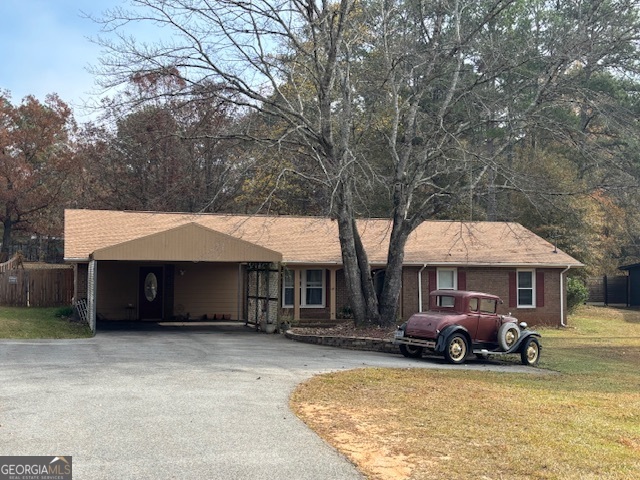 228 Sivell Road LaGrange, GA 30241 - Photo 51 of 64 a front view of a house with garden