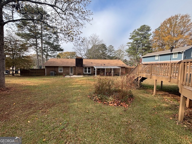 228 Sivell Road LaGrange, GA 30241 - Photo 62 of 64 a backyard of a house with table and chairs