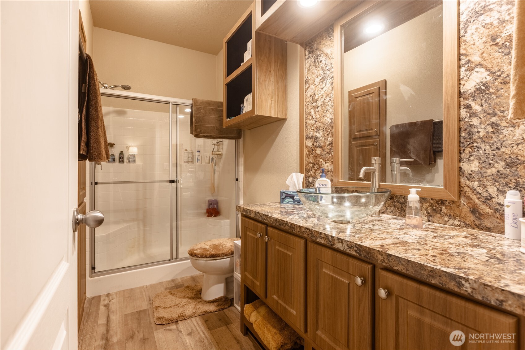 20 Northeast Mallard Way Hoodsport, WA 98548 - Photo 11 of 23 a bathroom with a granite countertop sink toilet and shower