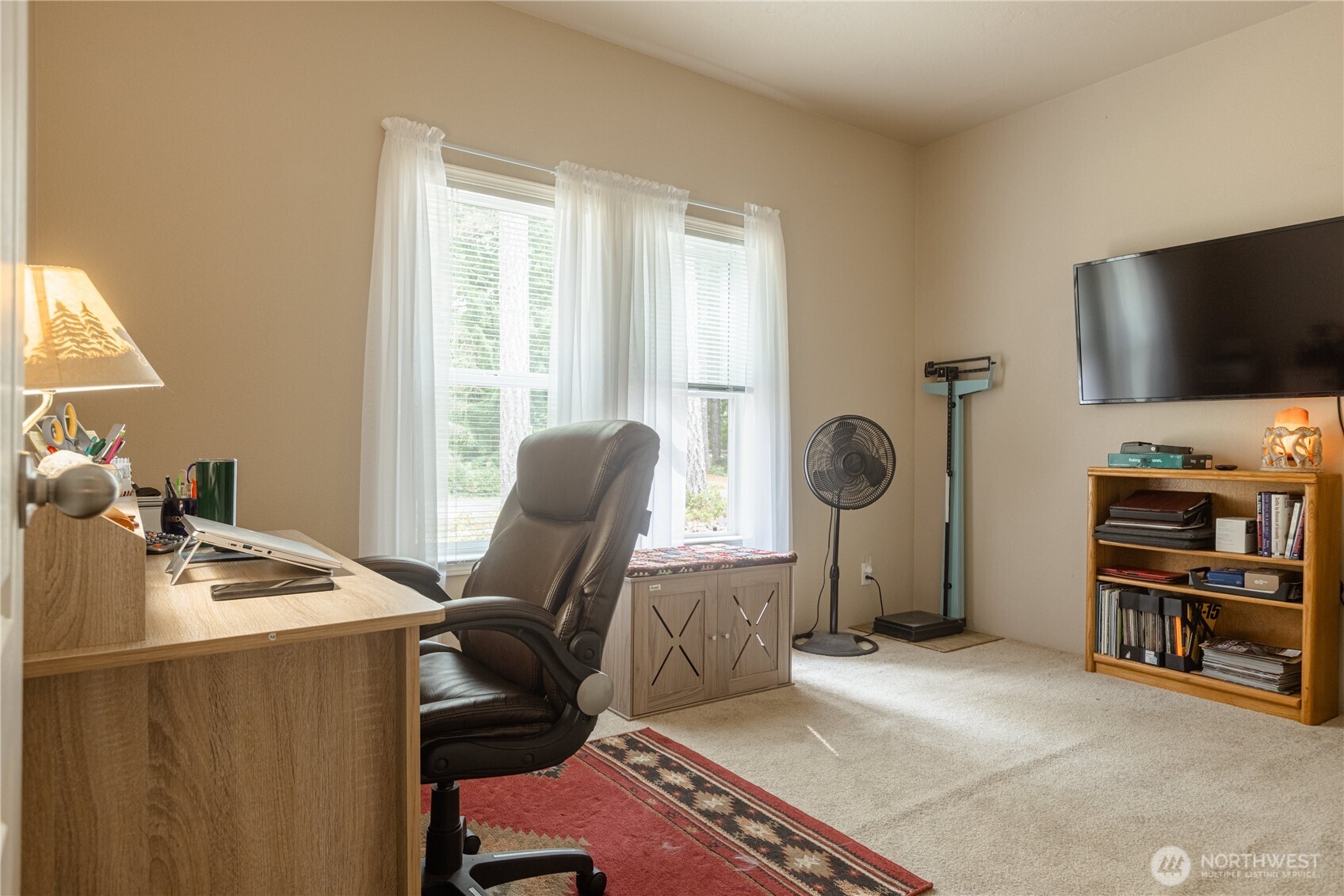 20 Northeast Mallard Way Hoodsport, WA 98548 - Photo 13 of 23 a room with furniture a flat screen tv and a window