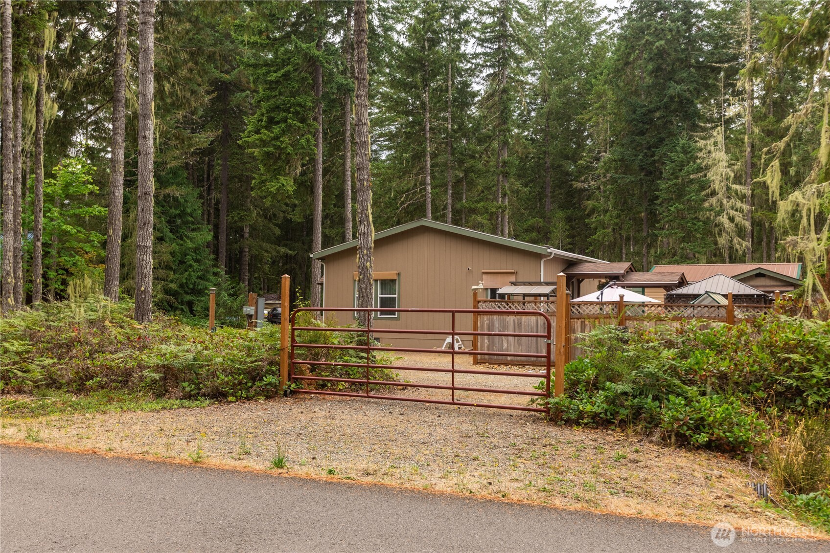 20 Northeast Mallard Way Hoodsport, WA 98548 - Photo 15 of 23 a view of a house with a small yard