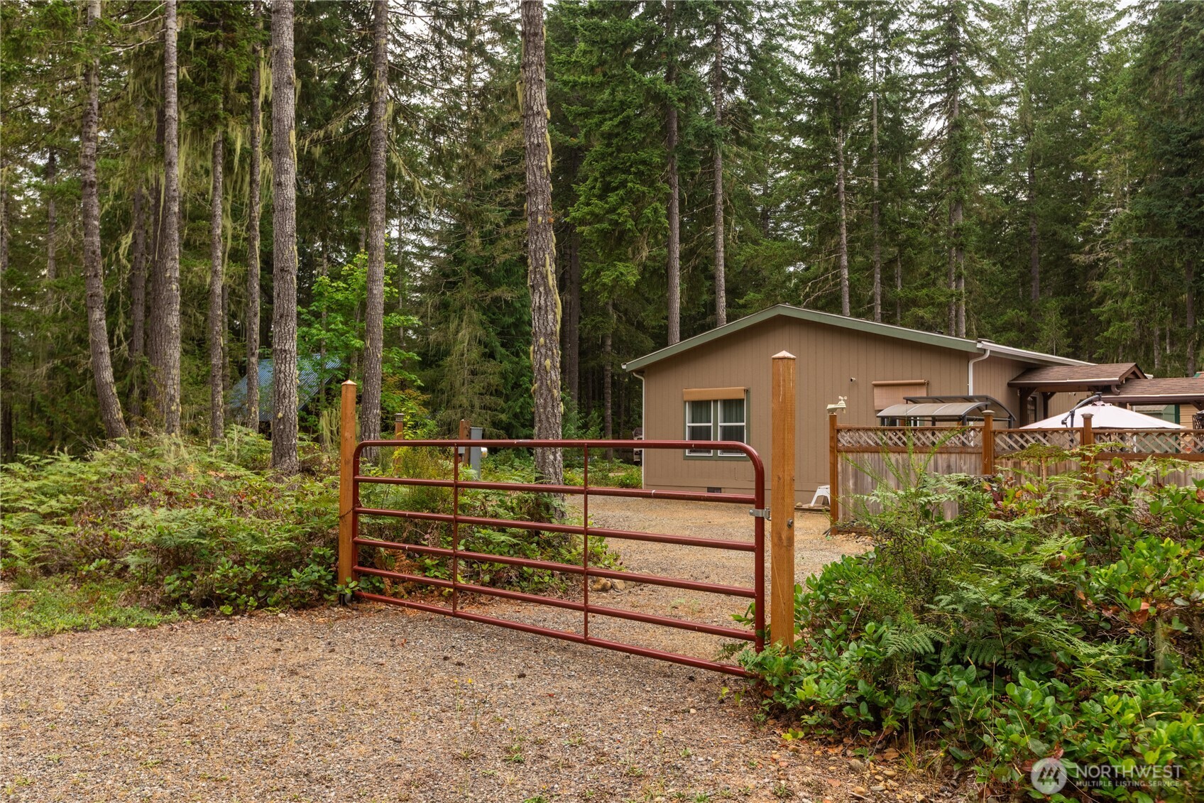 20 Northeast Mallard Way Hoodsport, WA 98548 - Photo 16 of 23 a front view of a house with a yard