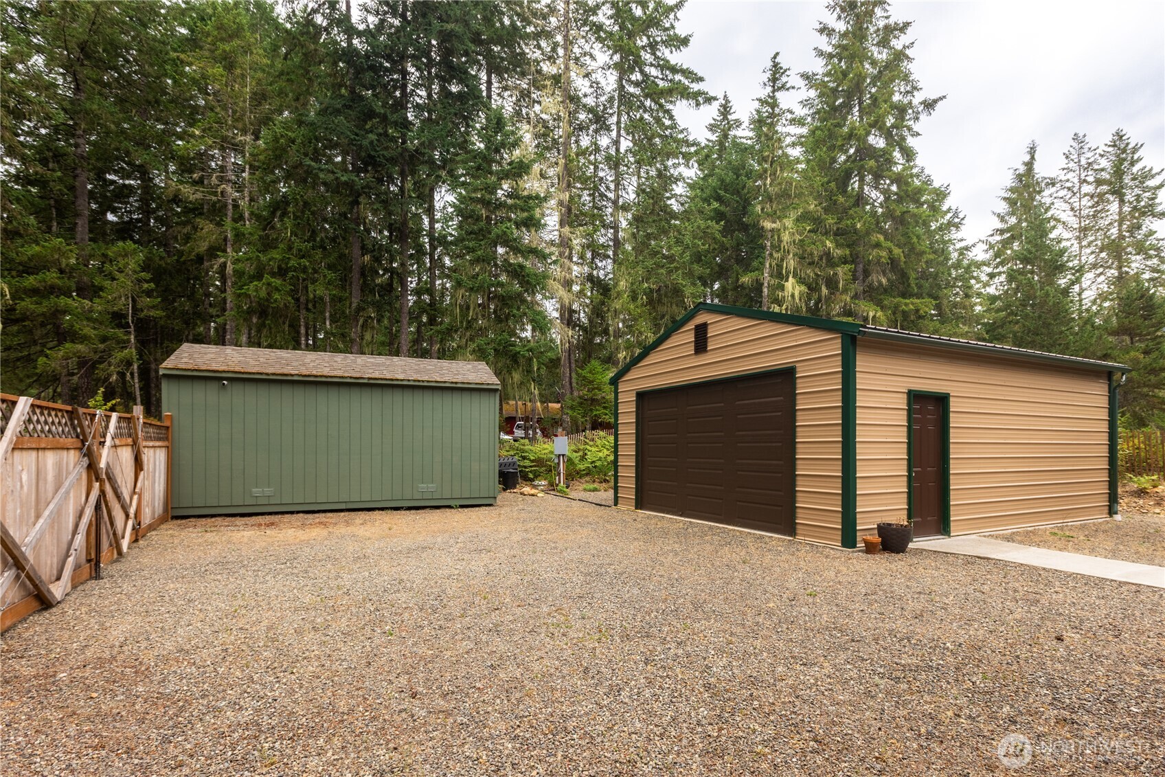 20 Northeast Mallard Way Hoodsport, WA 98548 - Photo 17 of 23 a front view of a house with a yard and garage