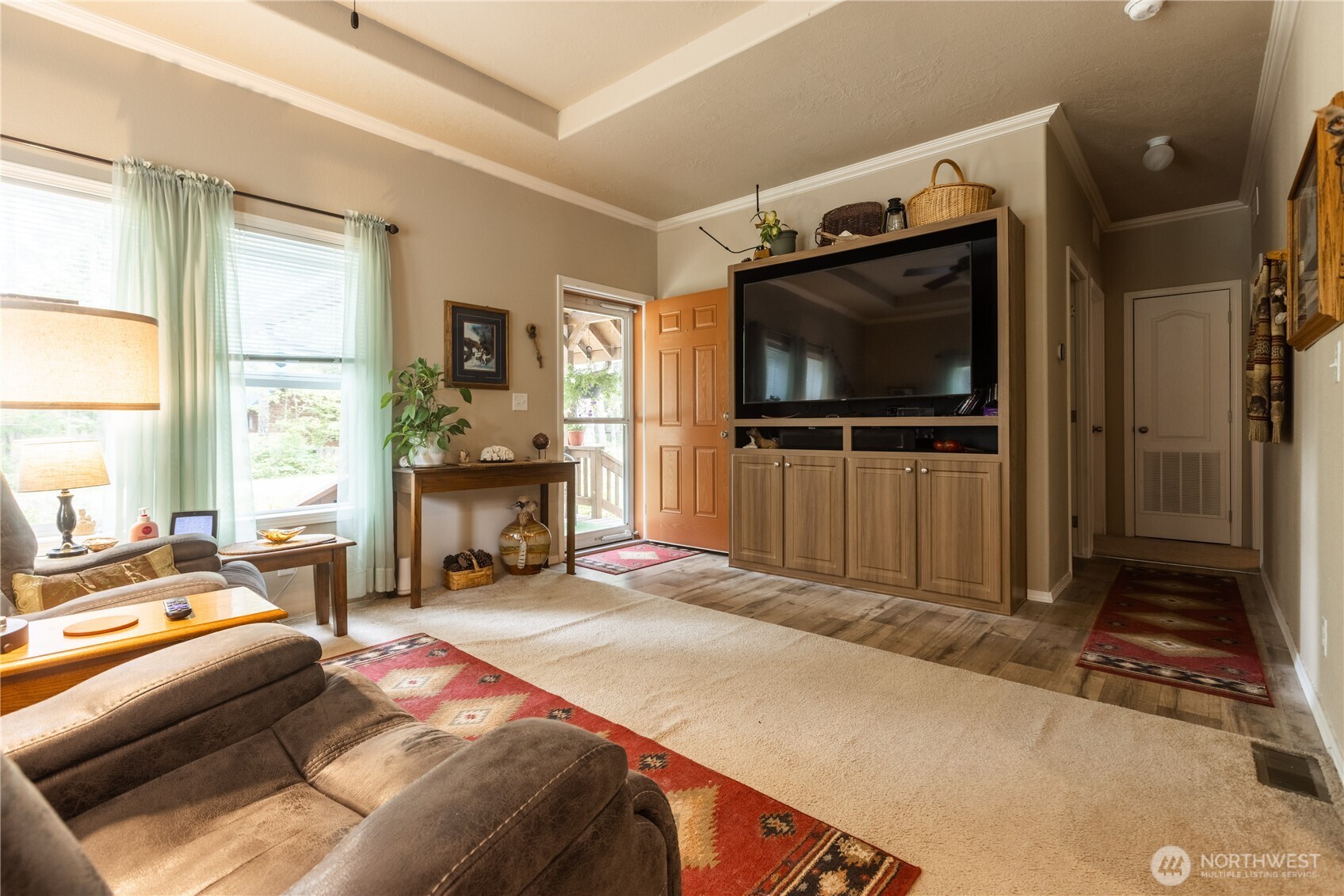 20 Northeast Mallard Way Hoodsport, WA 98548 - Photo 6 of 23 a bedroom with furniture and a flat screen tv