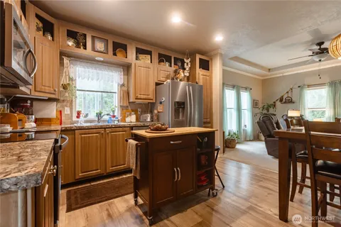 a kitchen with granite countertop lots of counter top space and dining table