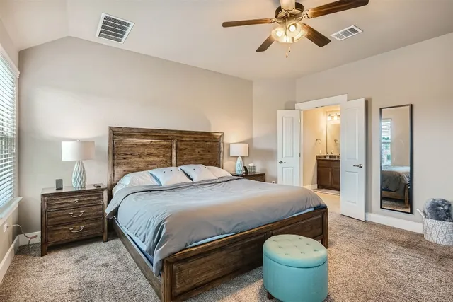 a bed room with a bed and a dresser