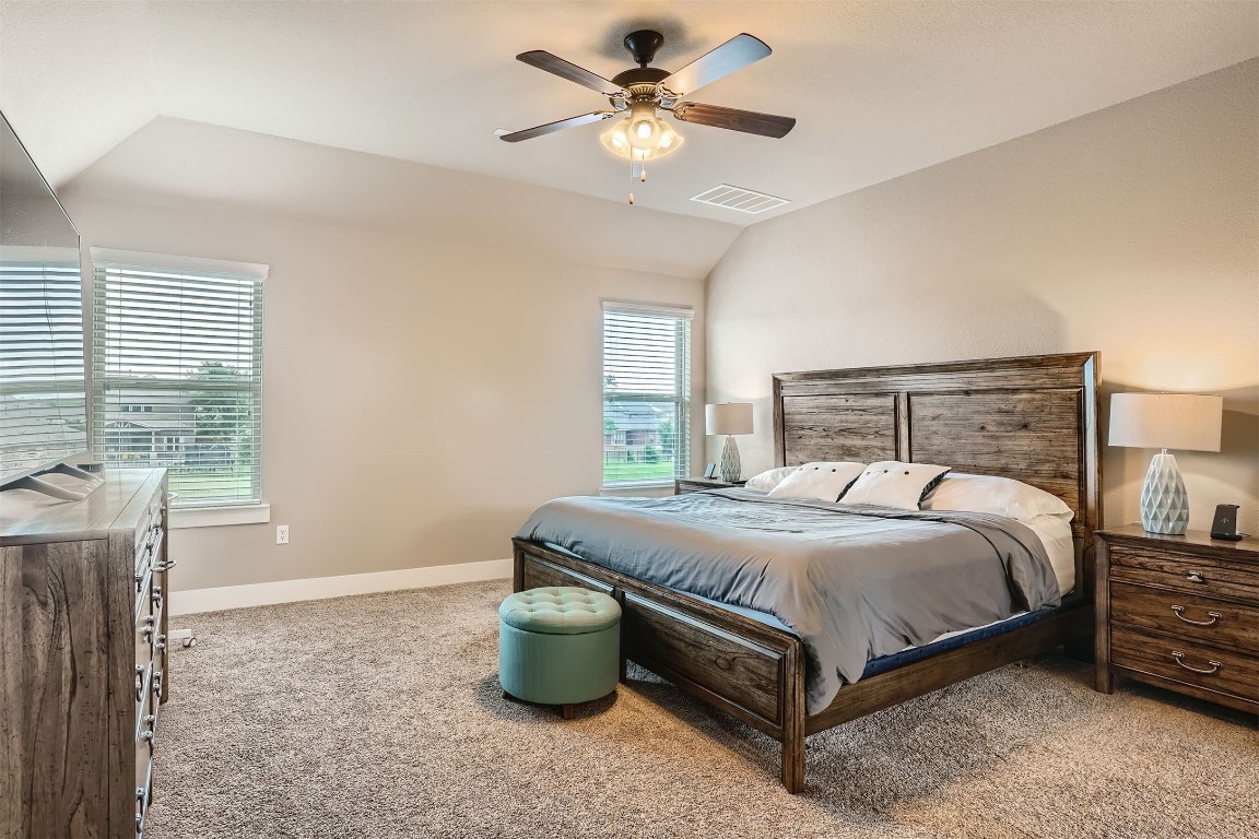 9401 McKnight Loop, Unit 6 Austin, TX 78717 - Photo 19 of 28 a bedroom with a bed and window
