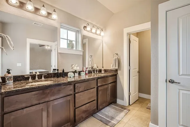 a bathroom with a sink a mirror and a shower