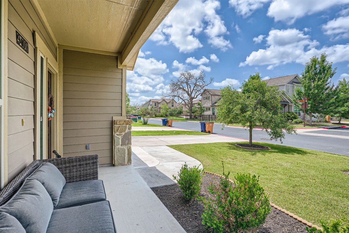 9401 McKnight Loop, Unit 6 Austin, TX 78717 - Photo 4 of 28 a view of a swimming pool with a couches chairs and a yard