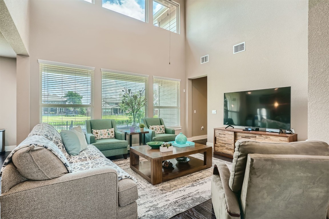9401 McKnight Loop, Unit 6 Austin, TX 78717 - Photo 6 of 28 a living room with furniture and a flat screen tv
